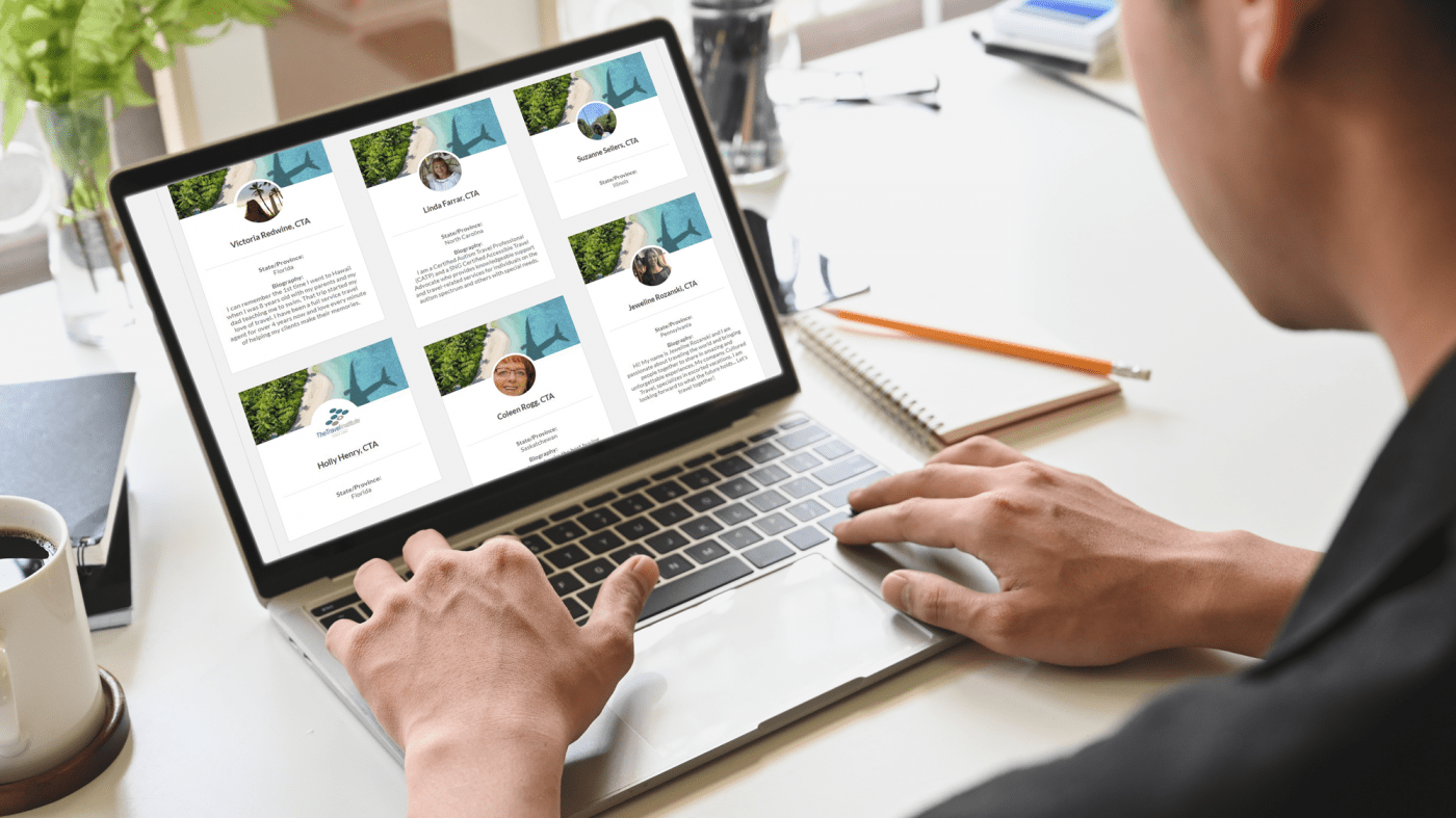Looking over the shoulder of a young man who is looking at the Certified Agent Directory