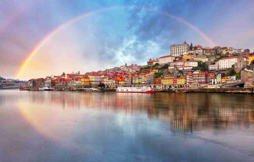 Porto, Portugal with a rainbow over it.