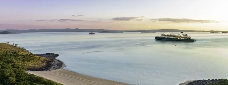 The Seabourn Pursuit in an idyllic ocean setting