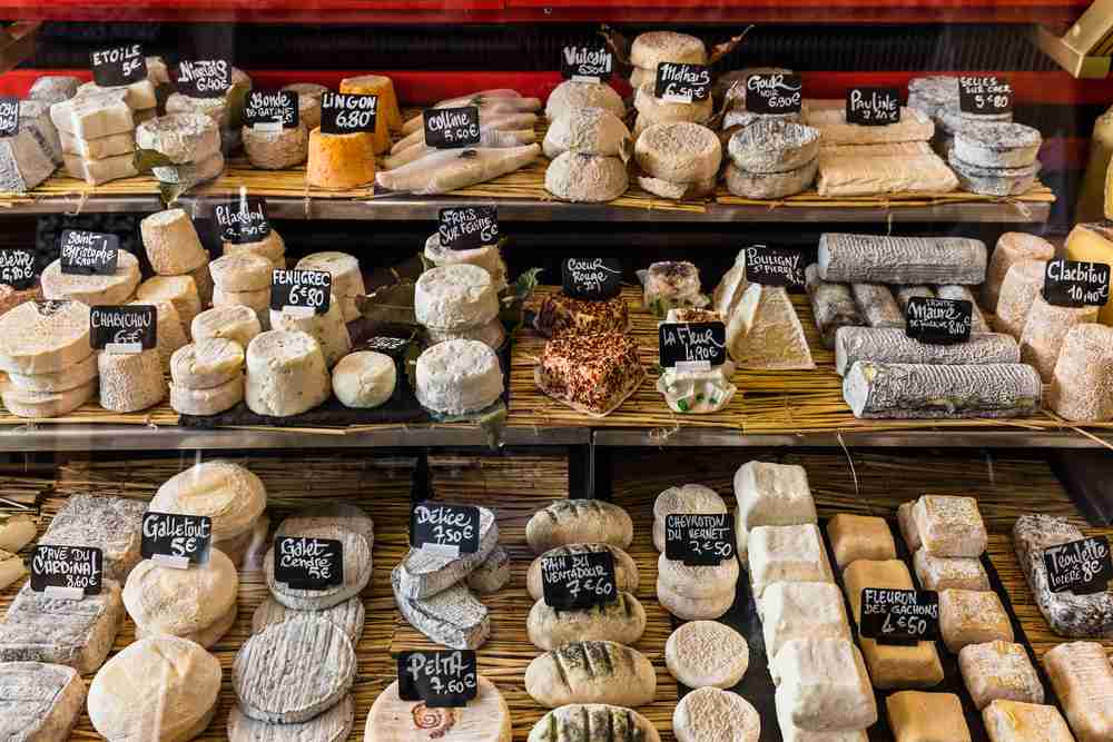 Selections of cheeses for sale - Premier Photo/Shutterstock.com