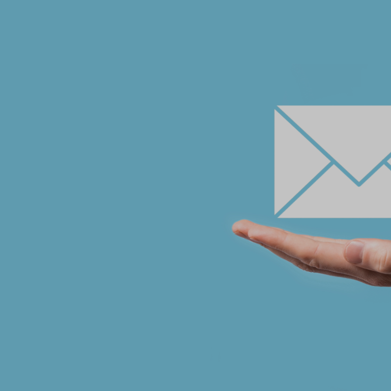 partial image of a hand with an icon of an envelope hovering above the hand