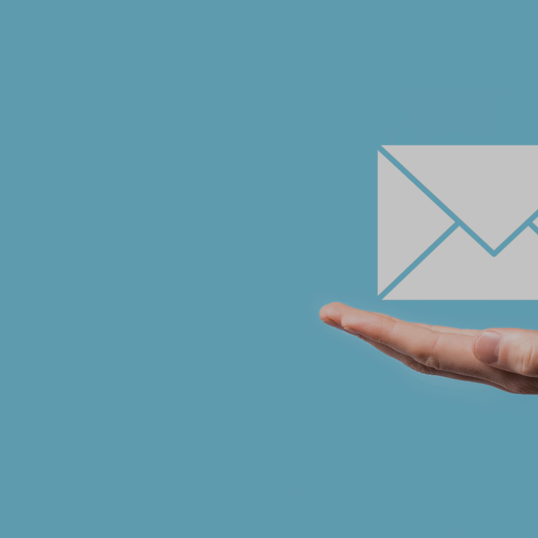 partial image of a hand with an icon of an envelope hovering above the hand