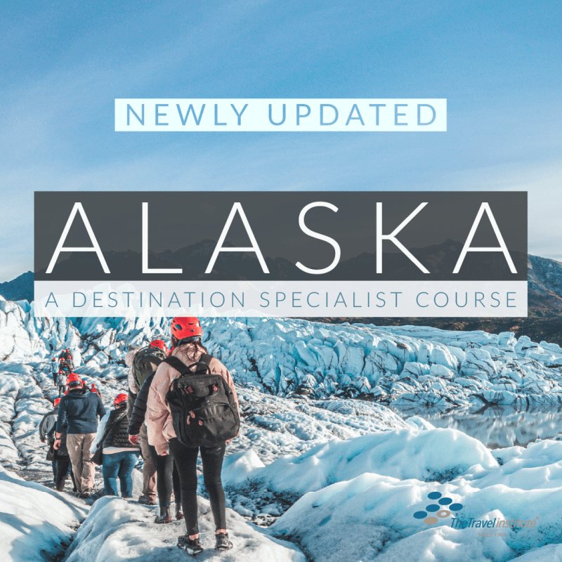 Four hikers are wearing coats and winter hats. They are facing backwards and hiking over a glacier. Alaska Specialist course text.